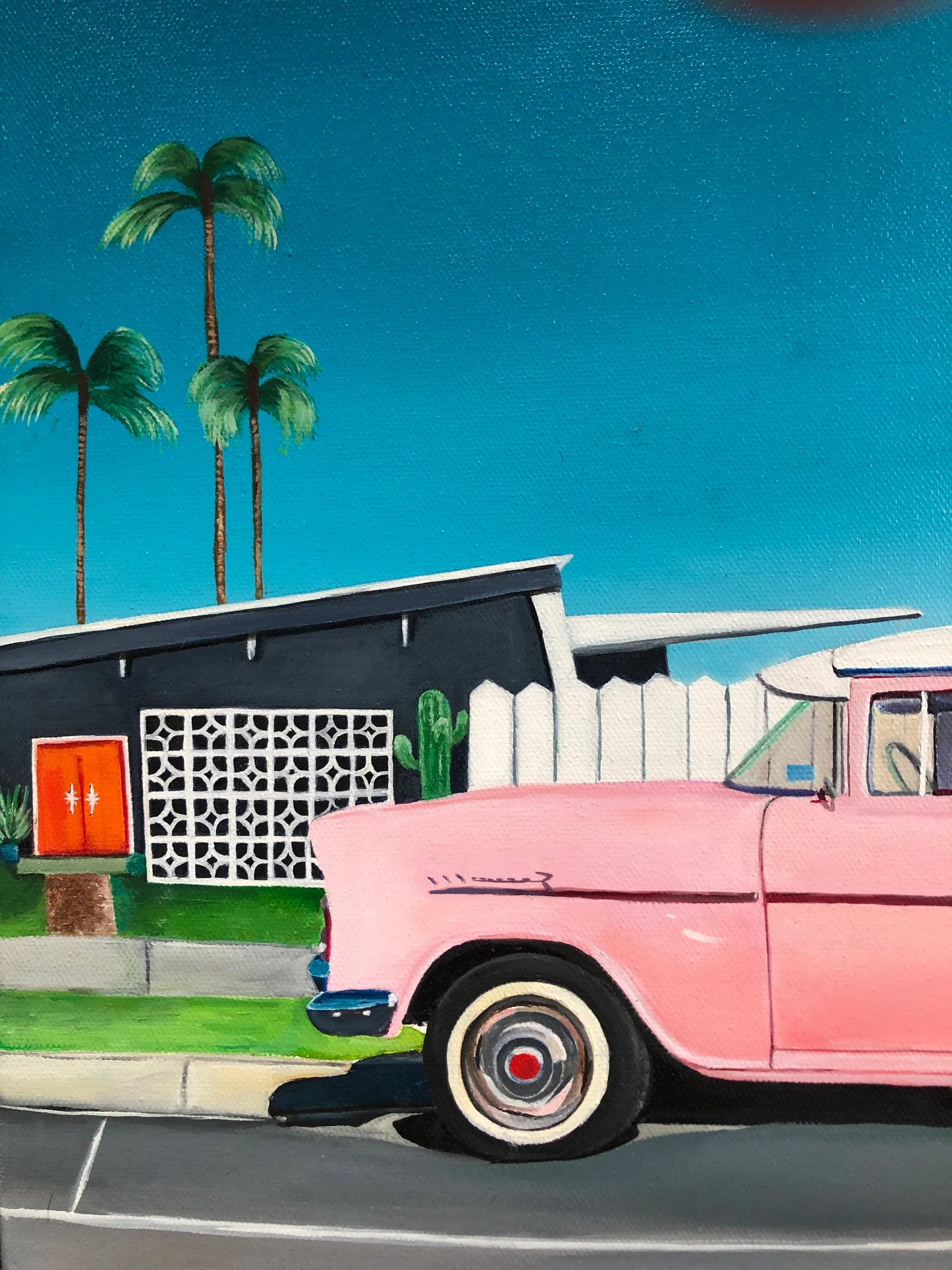 Pop art painting of a pink vintage car parked by a mid-century house with palm trees