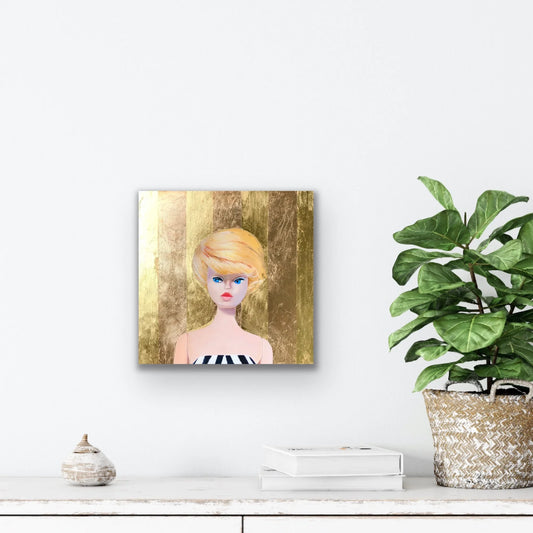Pop art painting of a vintage doll with blonde hair on a gold background, modern wall decor