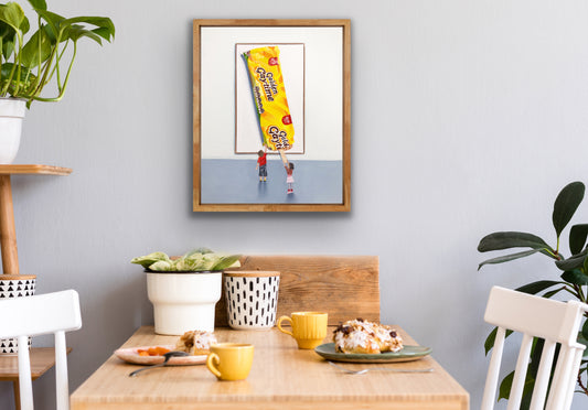 Framed pop art painting of children looking at a large Golden Gaytime ice cream in a modern dining area