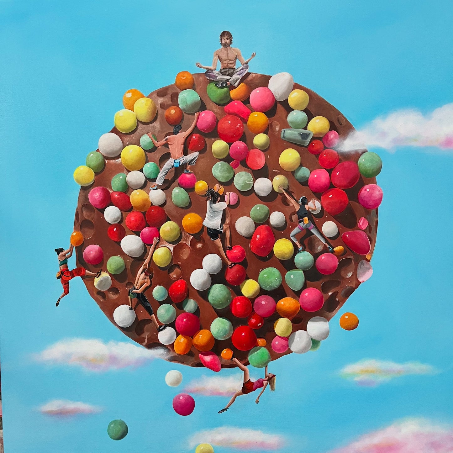 Chocolate cookie with colorful candies and people on a blue sky background
