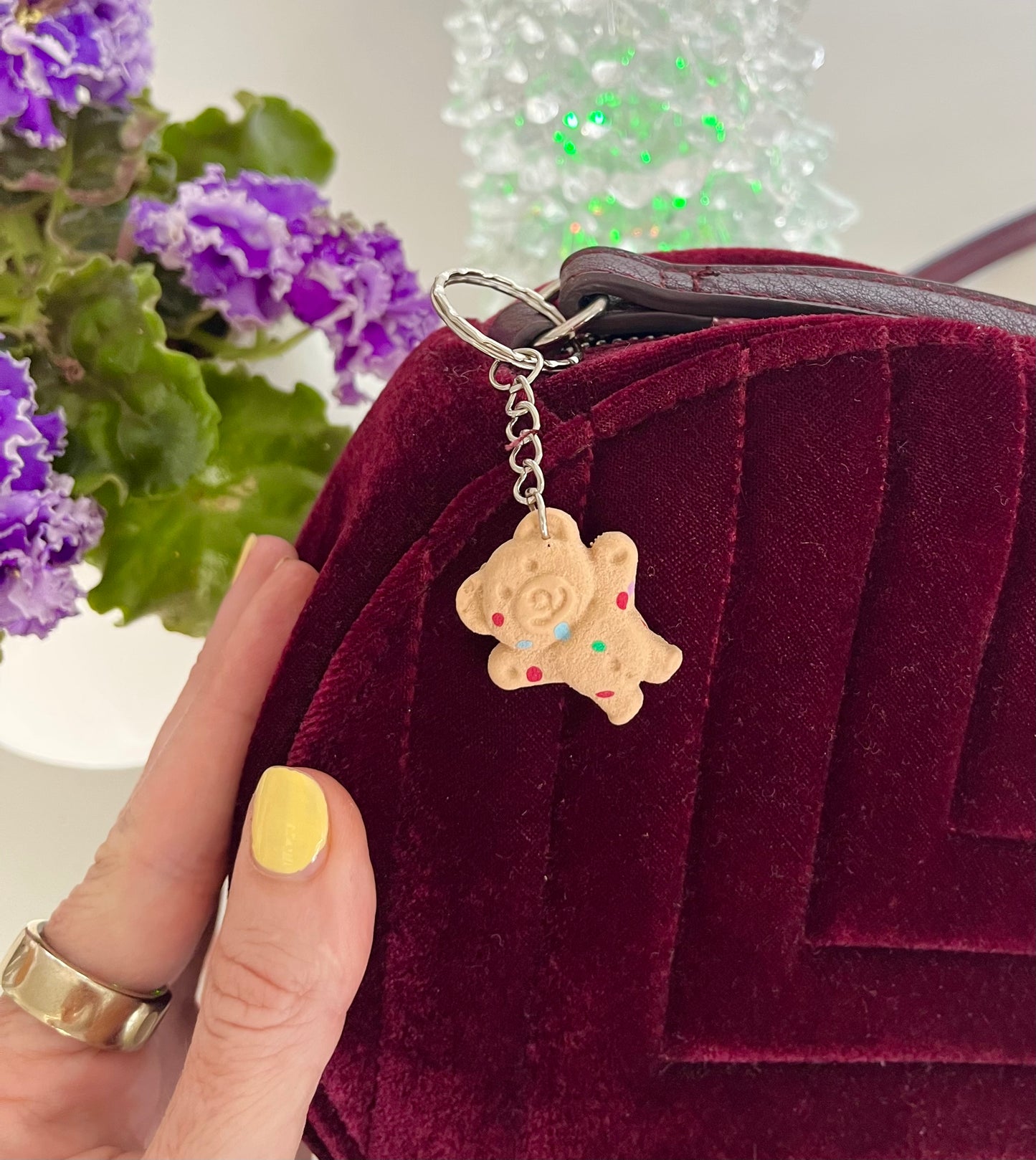 Maroon velvet bag with a hundreds and thousands tiny teddy keyring 