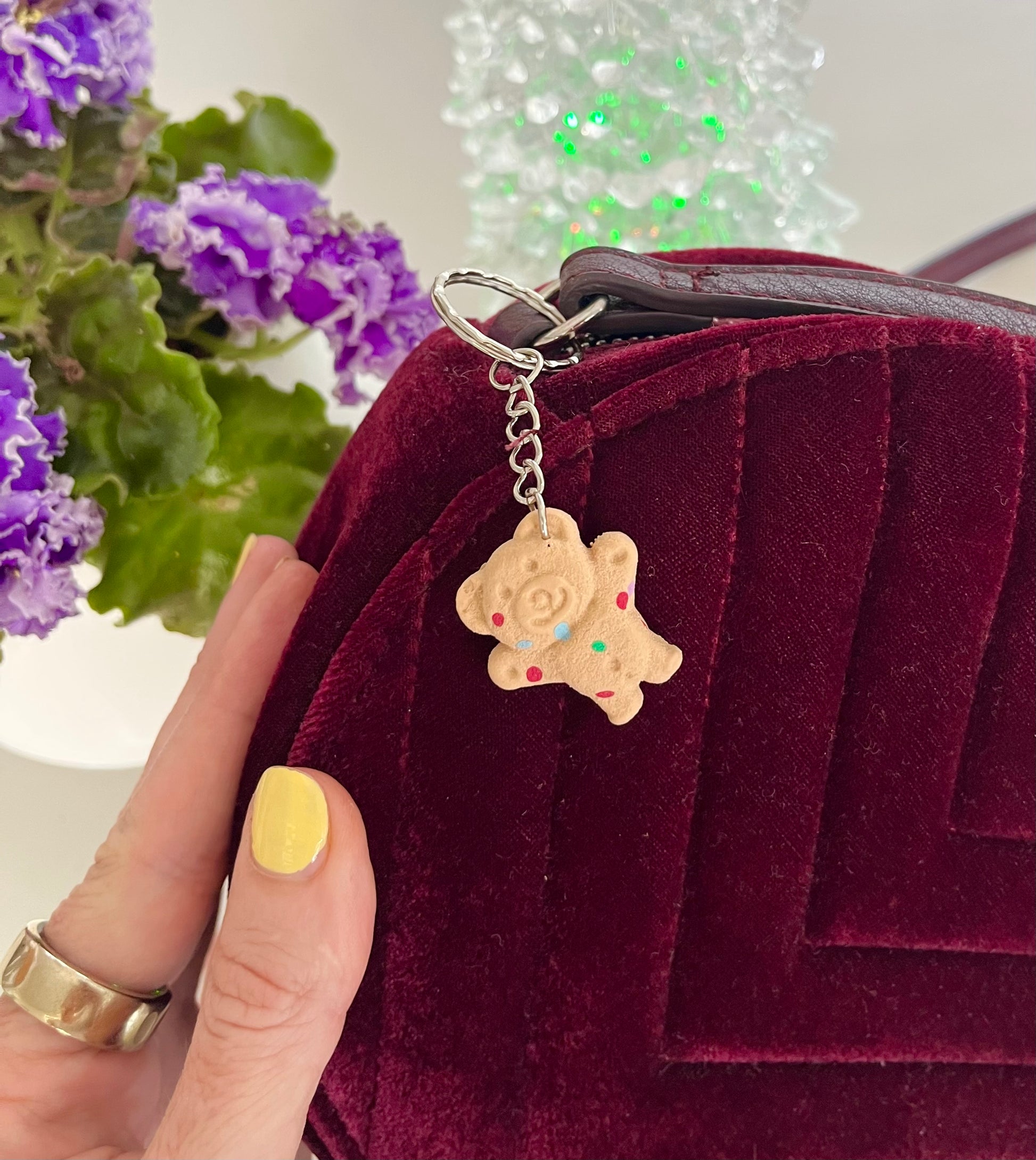Maroon velvet bag with a hundreds and thousands tiny teddy keyring 