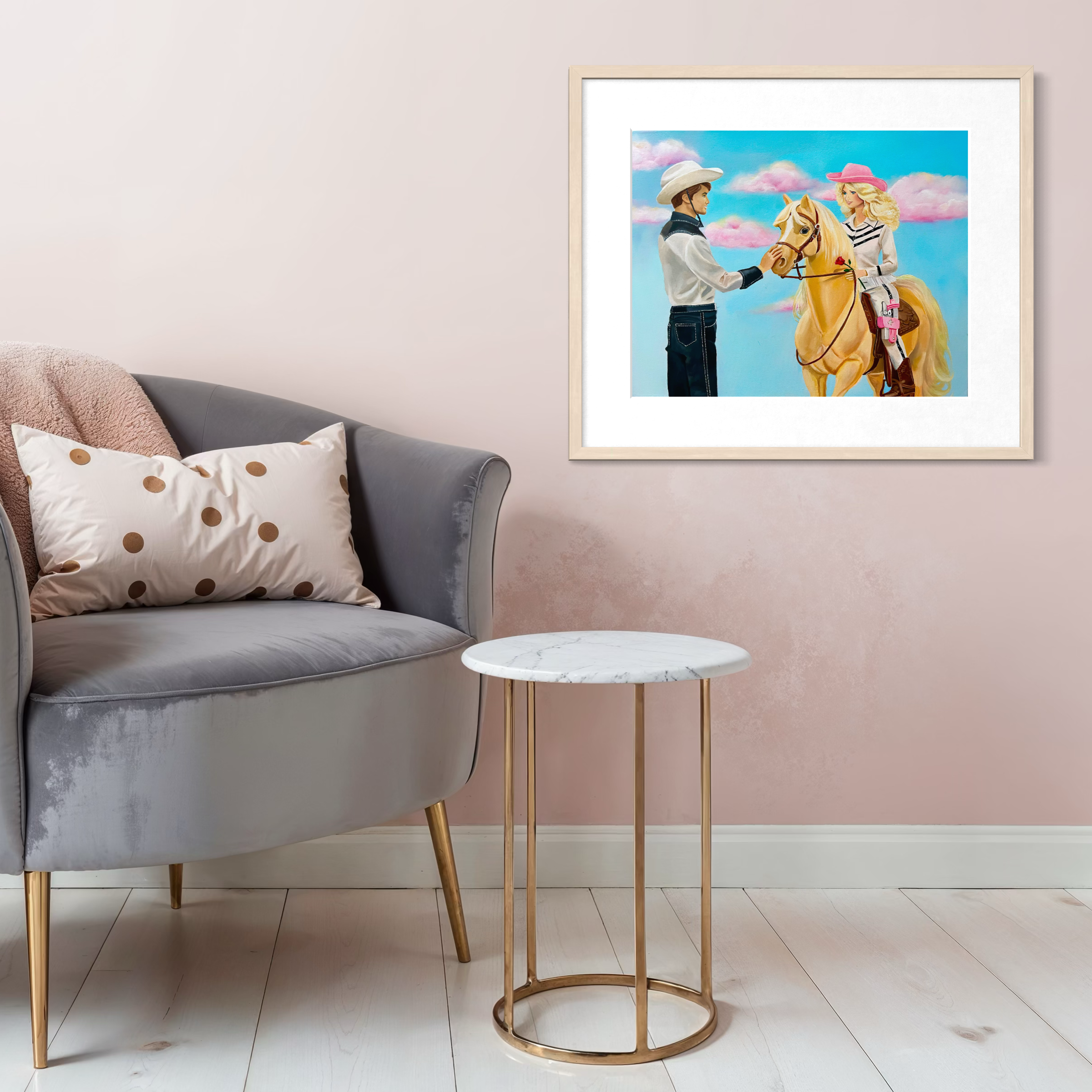 Framed artwork of a boy and girl on a horse above a gray sofa with decorative pillows.