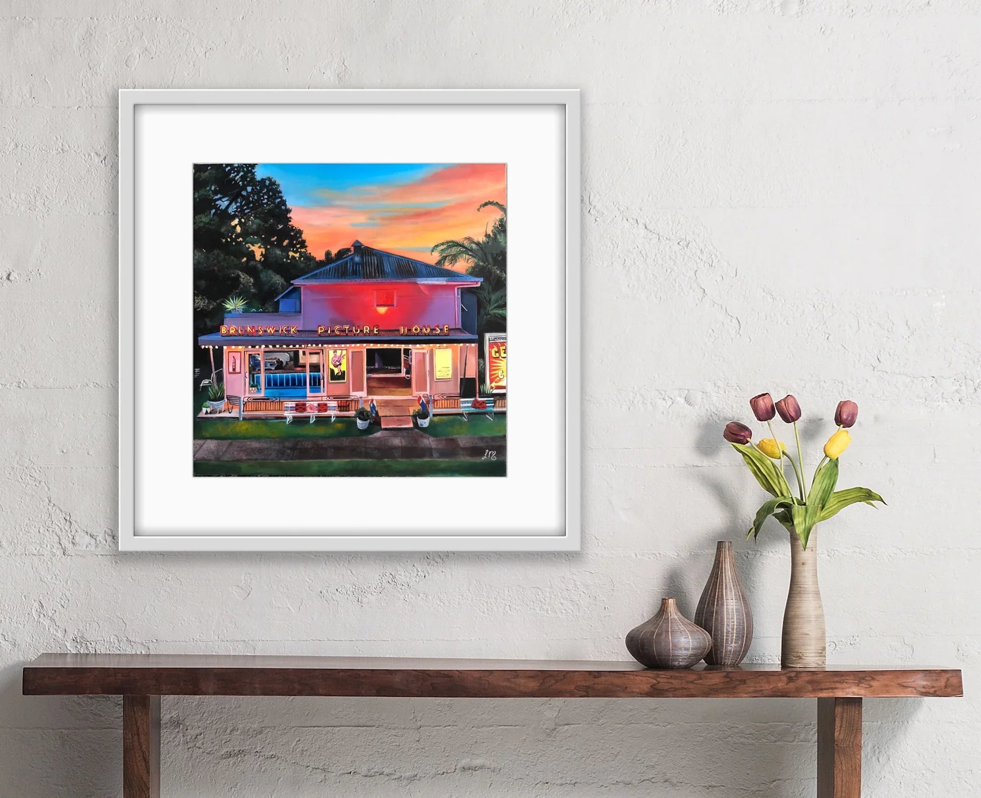 Framed pop art painting of Brunswick Picture House at sunset on modern wall